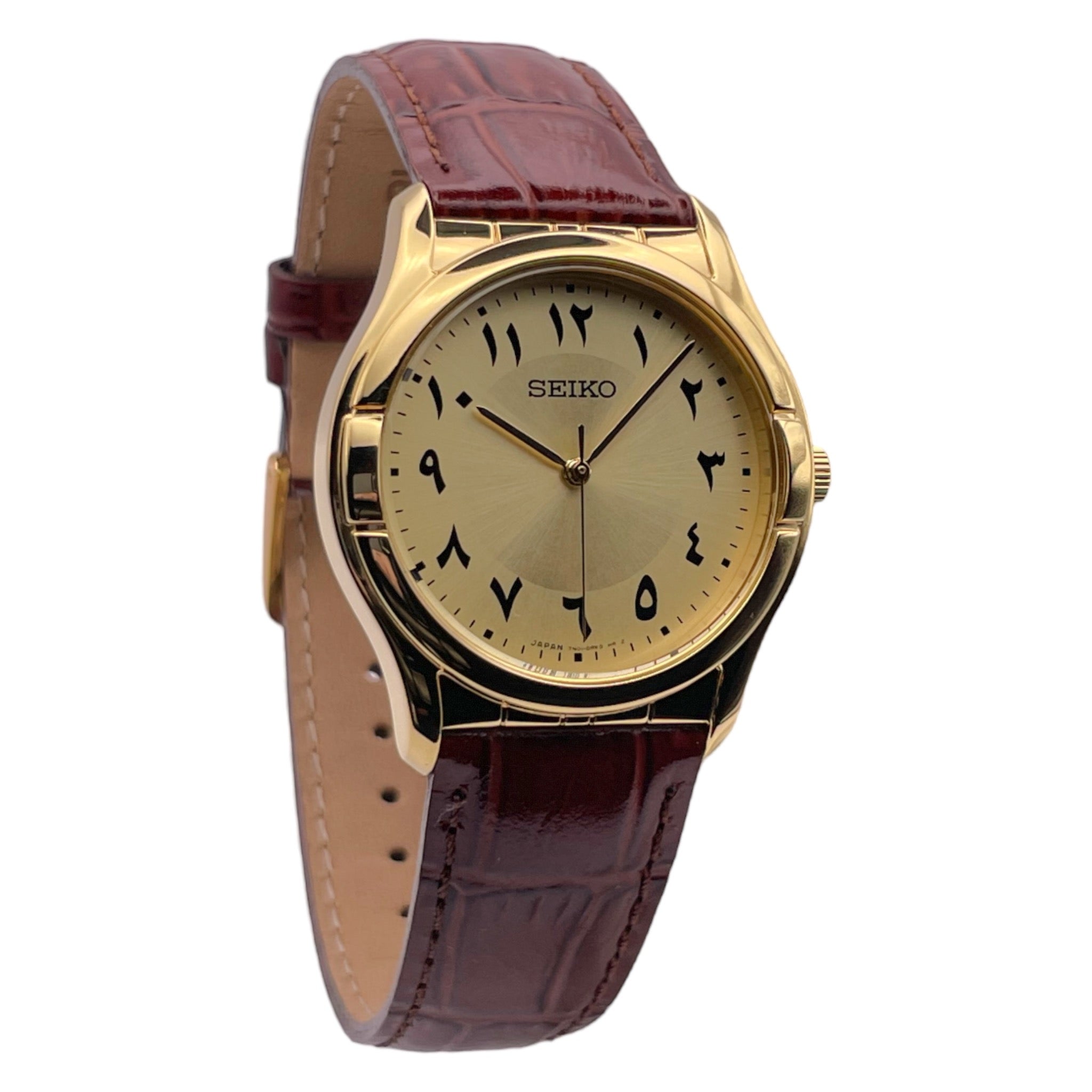 Seiko dorée avec bracelet en cuir marron, édition limitée avec chiffres arabes, vue de côté