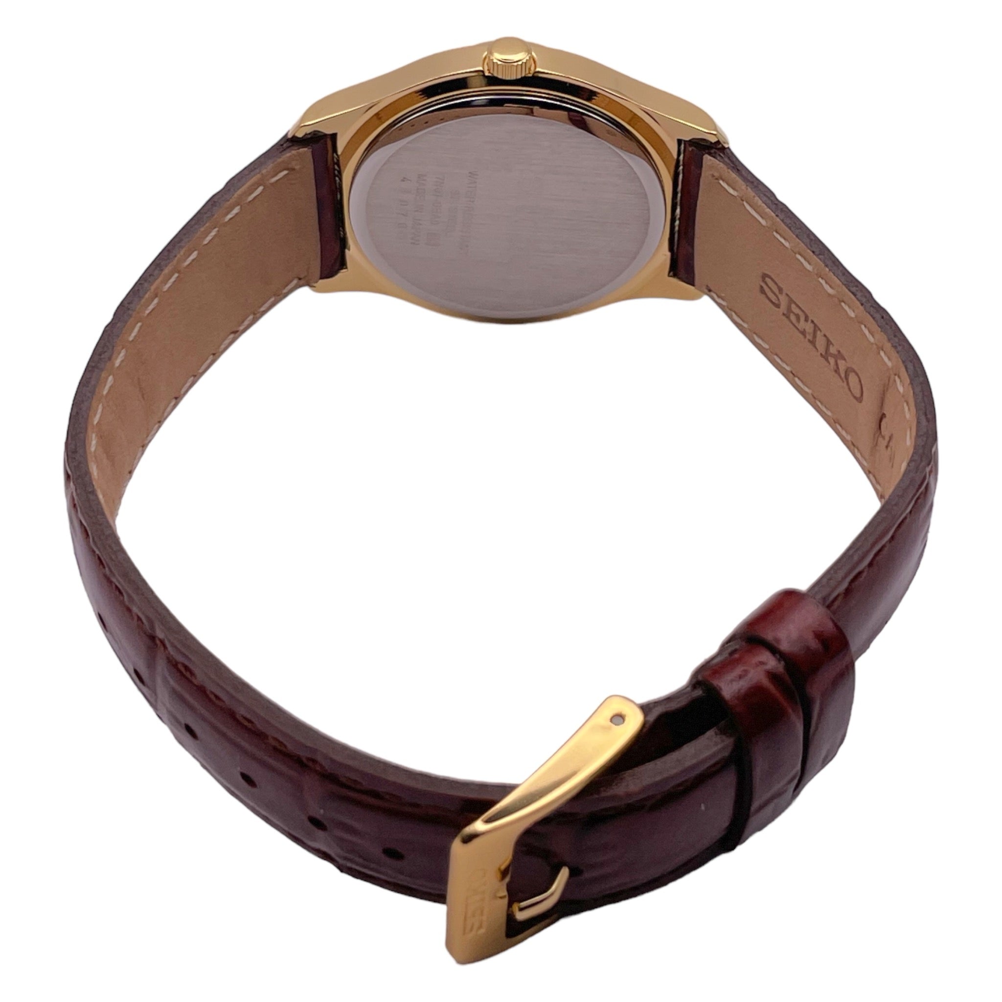 Seiko dorée avec bracelet en cuir marron, édition limitée avec chiffres arabes, vue de dos