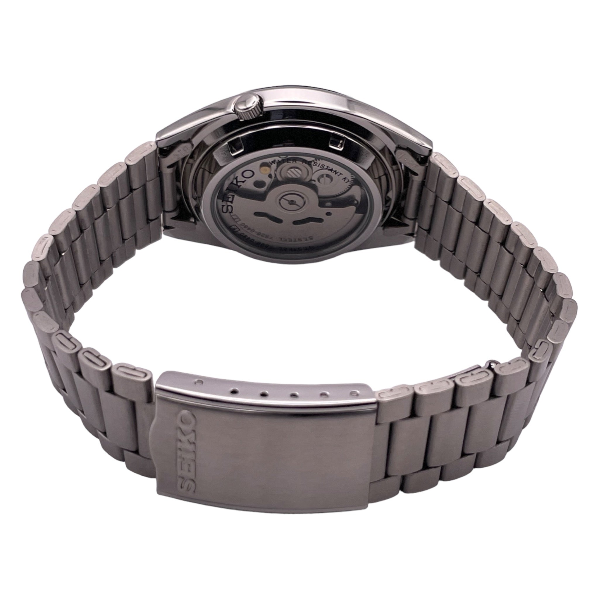 Montre Seiko avec bracelet métallique et cadran de 37mm, fond argenté, vue de dos